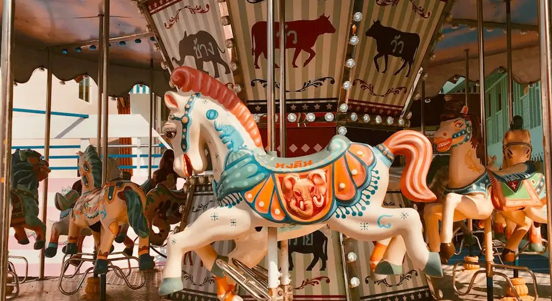 Colorful carousel horses on a merry-go-round